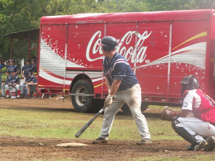 AIA Nicaragua Baseball player Ty Shaw is at bat.  Please nottice the CocaCola Truck driving in between him and our dug out during the game.  This and many other surprises magically appear during the games ! lol