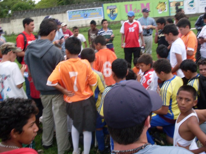 Tyler Wrinkle & Jake Ware meeting with kids during many little league soccer games that were happening in the baseball stadium that we were suppose to play in.  Thankfully we had a flexible team and we got to share the gosepl 3 different times wiith the little guys and we played some soccer while others fending off the kids from our stuff lol! 